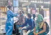  ?? PRATIK CHORGE/HT PHOTO ?? A healthcare worker collects the swab sample of a passenger for Covid-19 antigen test at CSMT on Saturday.