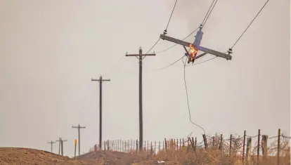  ?? DAVID ERICKSON/ASSOCIATED PRESS FILE PHOTO ?? A utility pole burns Feb. 28 in the Smokehouse Creek Fire in Canadian, Texas. The utility provider Xcel Energy said Thursday its facilities appeared to have played a role in igniting a massive wildfire in the Texas Panhandle.