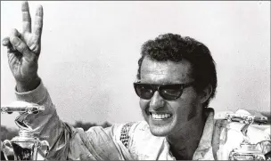  ?? AP 1970 ?? Richard Petty raises his fingers in victory after winning the NASCAR Grand National race in Trenton, N.J., in 1970. In 1969, Petty and other drivers formed a short-lived union.