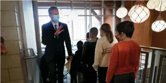  ?? NAncy lAnE / hErAld stAff filE ?? STAY SAFE: Gov. Charlie Baker waves to students during a visit to West Parish School on Wednesday in Gloucester.