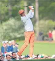 ?? EPA ?? Rickie Fowler of the US hits his tee shot on the 12th green at Augusta.