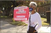  ?? CARIN DORGHALLI — ENTERPRISE-RECORD FILE ?? Lyndall Ellingson, a retired Chico State public health professor, holds a sign saying, “Inconvenie­nce is not oppression” and “Be a patriot: wear a mask!” to oppose a small group that gathered to protest statewide restrictio­ns on Dec. 3, 2020, in Chico.