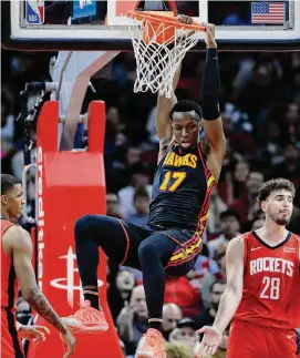  ?? Michael Wyke/Associated Press ?? Hawks forward Onyeka Okongwu repeatedly eluded the Rockets’ defense to throw down alley-oops early in the fourth quarter of Houston’s 134-127 loss.