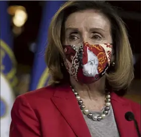  ?? JACQUELYN MARTIN / Ap ?? house speaker Nancy pelosi was narrowly re-elected sunday as speaker.