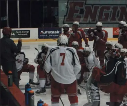  ??  ?? RPI Men’s Hockey listen to Head Coach Dave Smith run through the next drill at the Houston Field House at practice on October 3.