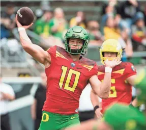  ??  ?? Oregon quarterbac­k Justin Herbert is a potential contender for the top overall pick in the 2020 NFL draft and could push the Ducks back into a New Year’s Six bowl.