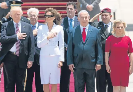  ?? Picture: AP. ?? US President Donald Trump and his wife Melania, and Israeli Prime Minister Benjamin Netanyahu and his wife Sara stand during the welcome ceremony in Tel Aviv, Israel.