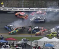  ?? CHRIS O’MEARA - THE ASSOCIATED PRESS ?? Cars collide on the 14th lap during the NASCAR Daytona 500 auto race at Daytona Internatio­nal Speedway, Sunday, Feb. 14, 2021, in Daytona Beach, Fla.