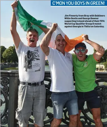  ??  ?? Jim Finnerty from Bray with Dubliners Willie Devlin and George Downer supporting Ireland ahead of their FIFA World Cup Qualifier Group D match against Georgia in Tbilisi on Saturday.