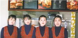  ?? SAMTAESONG ?? Staff at Samtaesong, the first fast-food franchise in North Korea.