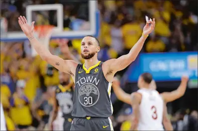  ?? MARCIO JOSE SANCHEZ/AP PHOTO ?? Warriors guard Stephen Curry celebrates during the second half of Game 2 of the NBA Finals against the Cavaliers on Sunday night at Oakland, Calif.