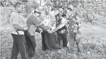  ??  ?? (From right) Joseph, Fadil and Yii join the volunteers picking rubbish at Lutong river confluence.