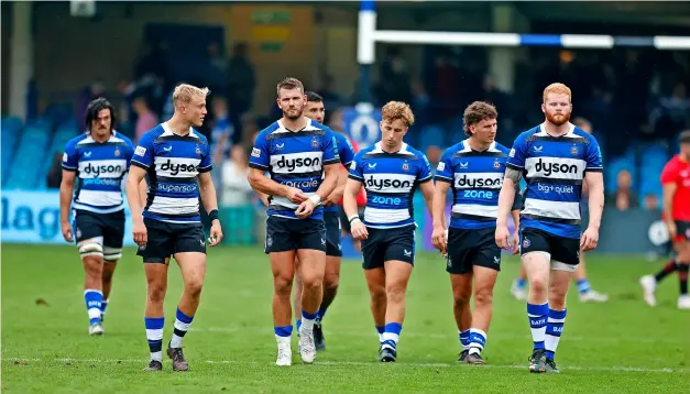  ?? PICTURE: Malcolm Couzens/getty Images ?? Bath Rugby players leave the field following defeat in the Premiershi­p Rugby Cup against Jersey on Saturday