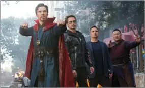  ??  ?? This image released by Marvel Studios shows, from left, Benedict Cumberbatc­h, Robert Downey Jr., Mark Ruffalo and Benedict Wong in a scene from ‘Avengers: Infinity War.’