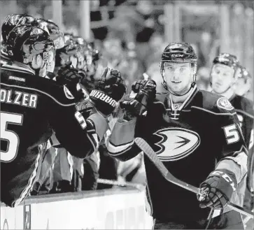  ?? Chris Carlson Associated Press ?? SHEA THEODORE, right, is joining the Ducks after a stint in the minors because of a poor training camp.