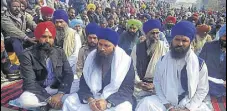  ?? HT PHOTO ?? Parallel jathedar of Takht Damdama Sahib Baljit Singh Daduwal (centre) with protesters at thermal plant in Bathinda.