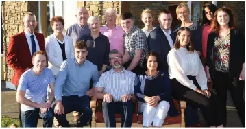  ?? Photo by Michelle Cooper Galvin ?? Diarmuid McCarthy, outgoing principal of Holy Family Primary School, at his retirement party after 45 years of teaching, with his wife Sheila, daughter Julie, sons Donnacha, Derry and Padraic. and family members Patrick, Donal and Mary McCarthy;...