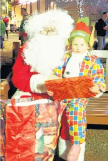  ??  ?? Excited Two-and-a-half-year old Molly Carnegie with Santa