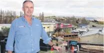  ?? PHOTO: TRACIE BARRETT ?? Something for everybody . . . Rory McLellan has a bird’seye view of demolition at the former Shooters Bar site from the balcony of his McLellan’s Plumbing and Heating business in Alexandra.