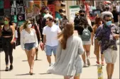  ?? GENARO MOLINA/LOS ANGELES TIMES ?? Visitors crowd the Boardwalk in Venice, Calif. on July 5.