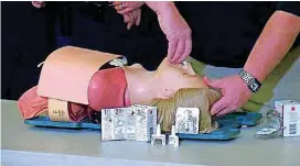  ?? [PHOTO BY GRAYSON COOK, THE OKLAHOMAN] ?? A Logan County reserve deputy sheriff demonstrat­es on a dummy how to use an overdose-reversing nasal spray.