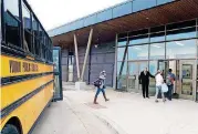  ?? [PHOTO PROVIDED] ?? A Yukon High School bus unloads at a bus entrance on the east side of the El Reno campus in 2017.