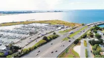  ?? STEPHEN M. KATZ/THE VIRGINIAN-PILOT ?? An aerial view of the tip of Willoughby Spit. A $200 million plan to build 300 condos would have transforme­d a piece of Willoughby Spit, a jut of land at one end of Norfolk formed by a hurricane in the 1700s.