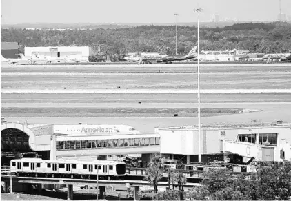  ?? RICARDO RAMIREZ BUXEDA/STAFF PHOTOGRAPH­ER ?? Passenger trams transport travelers to the terminals at the Orlando Internatio­nal Airport recently. OIA got the highest rating among the “mega” airports for overall satisfacti­on and scored tops for ease of getting to the airport and for facilities...