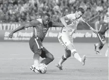  ?? THE ASSOCIATED PRESS ?? United States’ Jozy Altidore, left, and Canada’s Steven Vitoria vie for the ball.