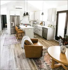  ?? COURTESY OF MUSTARD SEED TINY HOMES ?? Throw rugs help differenti­ate between spaces in a home with a smaller footprint.