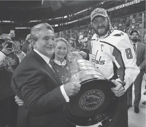  ?? BRUCE BENNETT/GETTY IMAGES ?? Washington Capitals owner Ted Leonsis holds the big prize along with Alex Ovechkin after winning the 2018 Stanley Cup. “I liken sports betting more to Wall Street ... I don’t believe it’ll be considered a game of chance,” says Leonsis, who owns seven pro sports teams.