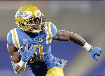  ?? Ashley Landis Associated­Press ?? THE VERSATILE Demetric Felton Jr. leaves UCLA as this year’s fourth- leading running back in the Pac- 12 with 111.3 yards per game and f ive touchdowns. He also caught 22 passes for 159 yards and three touchdowns.