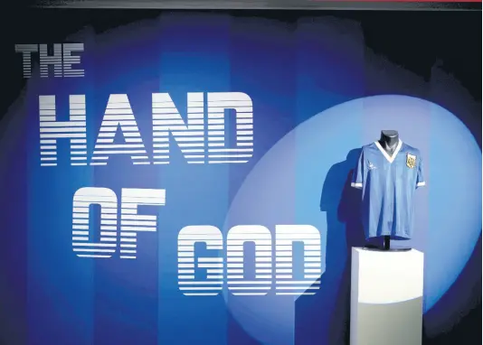  ?? AP ?? The Argentina football shirt worn by Diego Maradona in the 1986 Mexico World Cup quarterfin­al soccer match between Argentina and England, is displayed at Sotheby’s auction house, in London, Wednesday, April 20, 2022.