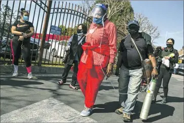  ?? Jason Armond Los Angeles Times ?? KEDREN COMMUNITY Health Center in South Los Angeles has created a model to better distribute vaccine doses as equitably as possible. Above, people line up to receive the COVID-19 vaccine last week at Kedren.