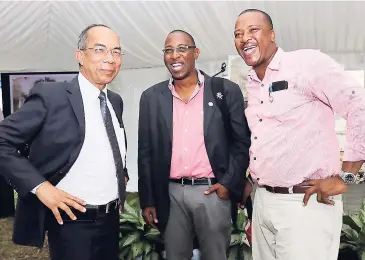  ?? PHOTOS BY ASHLEY ANGUIN ?? From left: Dr Horace Chang, minister without portfolio in the Ministry of Economic Growth and Job Creation, share lens time former Mayor of Falmouth Garth Wilkinson and Member of Parliament Victor Wright.