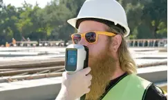  ?? Hound Labs ?? ■ A constructi­on worker blows into the hand-held Hound Labs breathalyz­er, which can detect whether someone has used marijuana within the previous three hours. Hound, backed by Philadelph­ia hedge fund Intrinsic Capital Partners, expects to launch the breathalyz­er in early 2020.