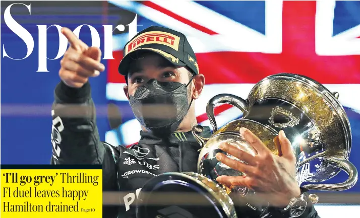 ??  ?? ‘Still got it’: Lewis Hamilton celebrates victory in the season-opening Bahrain Grand Prix after a fight to the finish against the Red Bull of Max Verstappen. He joked his hair would turn grey ‘if there are many more races like that’