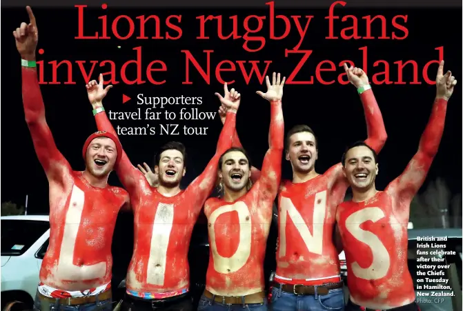  ?? Photo: CFP ?? British and Irish Lions fans celebrate after their victory over the Chiefs on Tuesday in Hamilton, New Zealand.