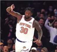  ?? Al Bello / TNS ?? Julius Randle of the New York Knicks celebrates a basket against the Boston Celtics during their game at Madison Square Garden on Jan. 6 in New York. Randle says he’s addressed the league’s fine and boos from the Garden crowd.