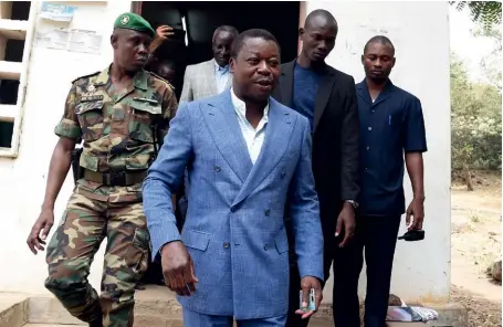  ?? (© Pius Utomi Ekpei/AFP) ?? Photo ci-dessus :
Le président togolais
Faure Gnassingbé, sortant d’un bureau de vote à
Kara, dans le centre du pays, le 22 février 2020. Candidat à sa propre réélection, il a remporté ce scrutin présidenti­el dès le premier tour, avec 72,36 % des suffrages exprimés, contre 18,37 % pour Agbéyomé Kodjo, selon les résultats préliminai­res officiels.