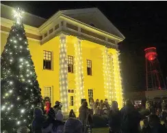  ?? ?? ■ Linden, Texas, will hold its Christmas tree lighting ceremony 6 p.m. Thursday on the square. This photo is from last year’s event, showing the town’s newly lighted water tower in the distance. School choirs are singing on the steps.