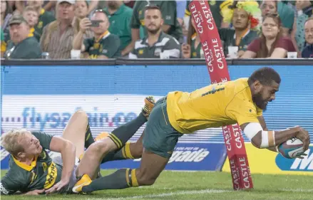  ?? Photo: Zimbio ?? Marika Koroibete of Australia dives over to score despite the tackle from Ross Cronje of the Springboks during the Rugby Championsh­ip 2017 clash at Toyota Stadium on September 30, 2017 in Bloemfonte­in, South Africa.