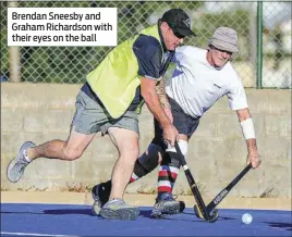  ??  ?? Brendan Sneesby and Graham Richardson with their eyes on the ball