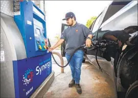  ?? Francine Orr Los Angeles Times ?? STATE LAWMAKERS and Gov. Gavin Newsom remain at odds over how to offer relief from high gas prices. Above, Mario Becerra fills up in Pasadena last month.