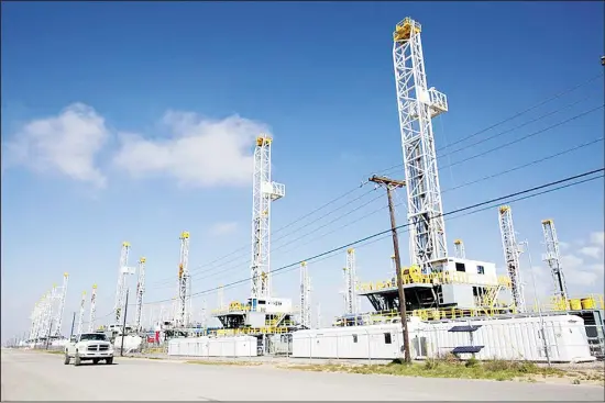  ??  ?? In this file photo, oil drilling rigs are seen standing idle in Odessa, Texas. The companies that pioneered the Permian Basin of West Texas are facing stark challenges. (AP)