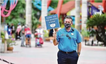  ?? Robin Jerstad / Contributo­r ?? Six Flags Fiesta Texas President Jeffrey Siebert greets guests Sunday during the park’s reopening weekend. Numerous COVID-19 safety protocols have been instituted at the San Antonio park.