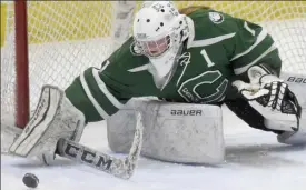  ?? JIM MICHAUD / BOSTON HERALD ?? TURNED ASIDE: Canton goaltender Carolyn Durand turns away a shot during the Div. 2 semifinal against Norwell.