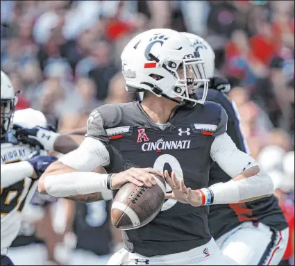  ?? Jeff Dean The Associated Press ?? QB Desmond Ridder’s play against ranked foes is one reason to take Cincinnati -3½ against Indiana.