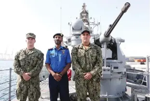  ??  ?? DOHA: Mohammed Dasmal Al-Kuwari (center), Qatari navy Chief Coordinato­r and Jon Anderson (right) and Benjamin Davni of the US navy are seen on a vessel during a joint military exercise between Qatar and the US navy on Friday. — AFP