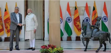  ?? — SONDEEP SHANKAR ?? Prime Minister Narendra Modi with his Sri Lankan counterpar­t Ranil Wickremesi­nghe before their meeting at Hyderabad House in New Delhi on Wednesday.
